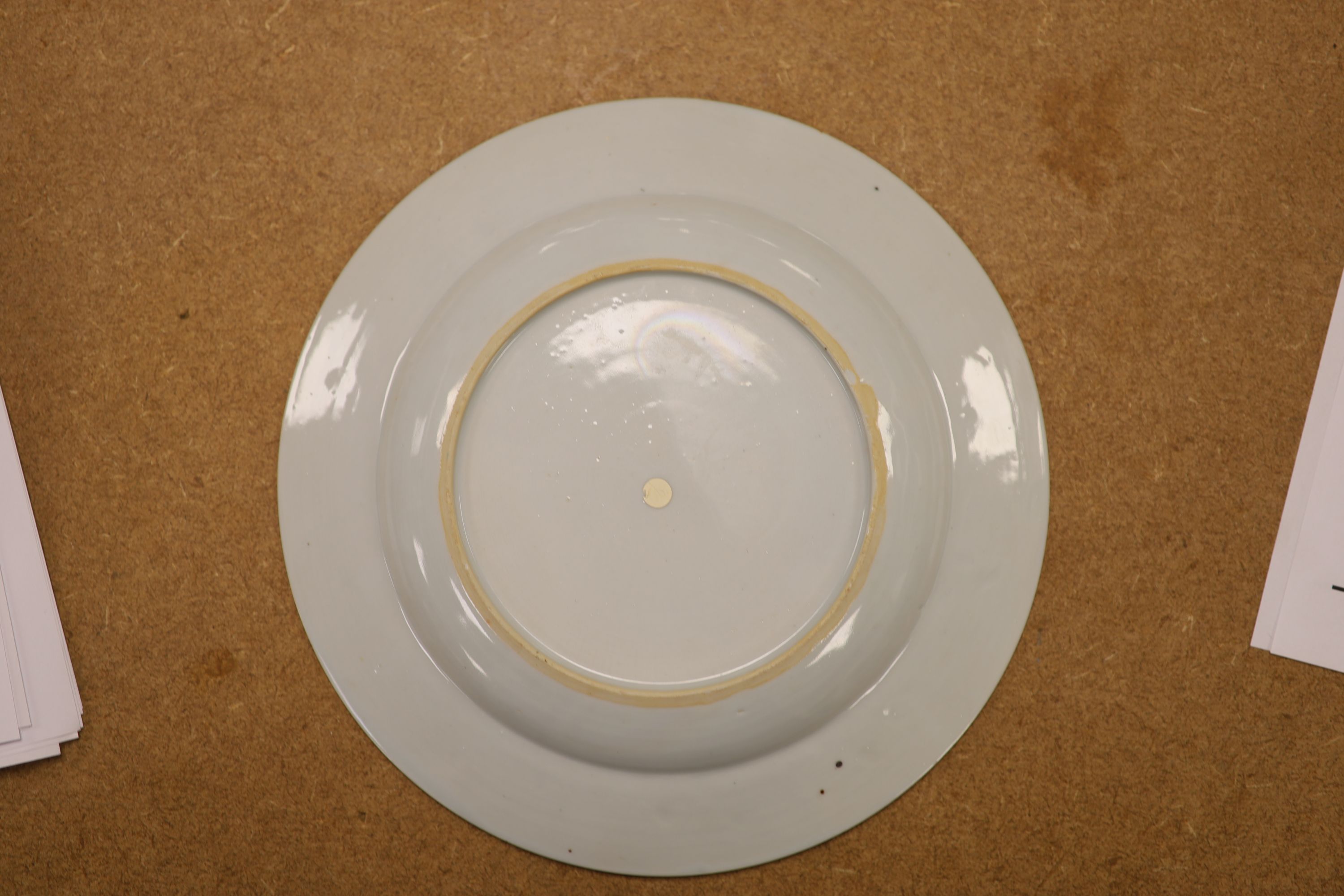 A pair of 18th century Chinese famille rose plates and another similar, largest diameter 22.5cm (damage)